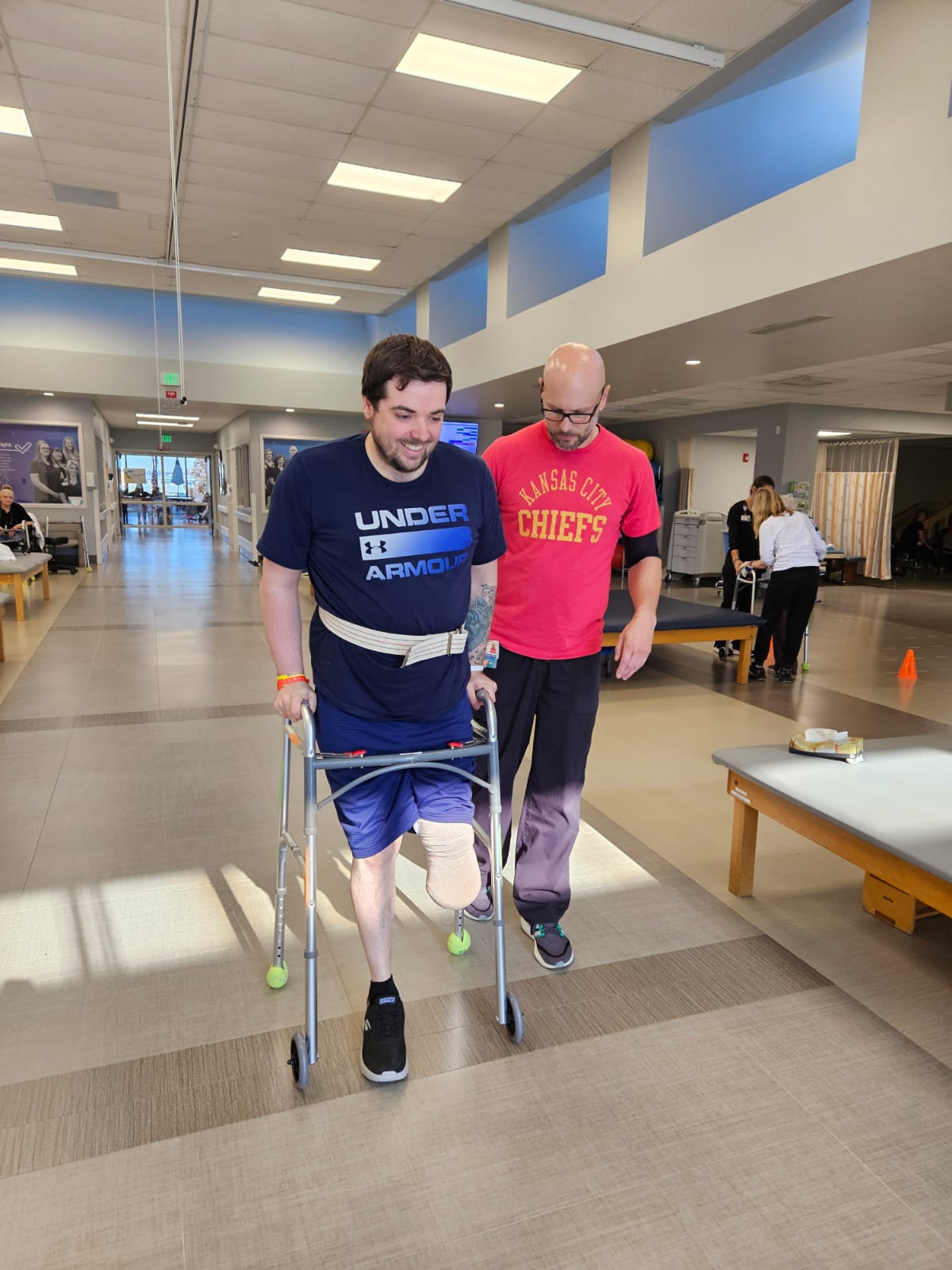 Working with a physical therapist in the rehab hospital, learning to walk with the walker after my amputation. Below the Knee Amputation Recovery - Personal Growth with the Enneagram - PadenJames.com